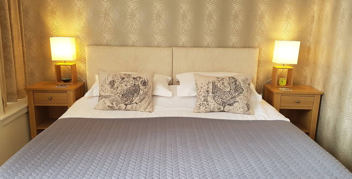 Snug Header Hotel standard super king bed